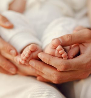 Parents with daughter. Family in a park. Newborn girl.